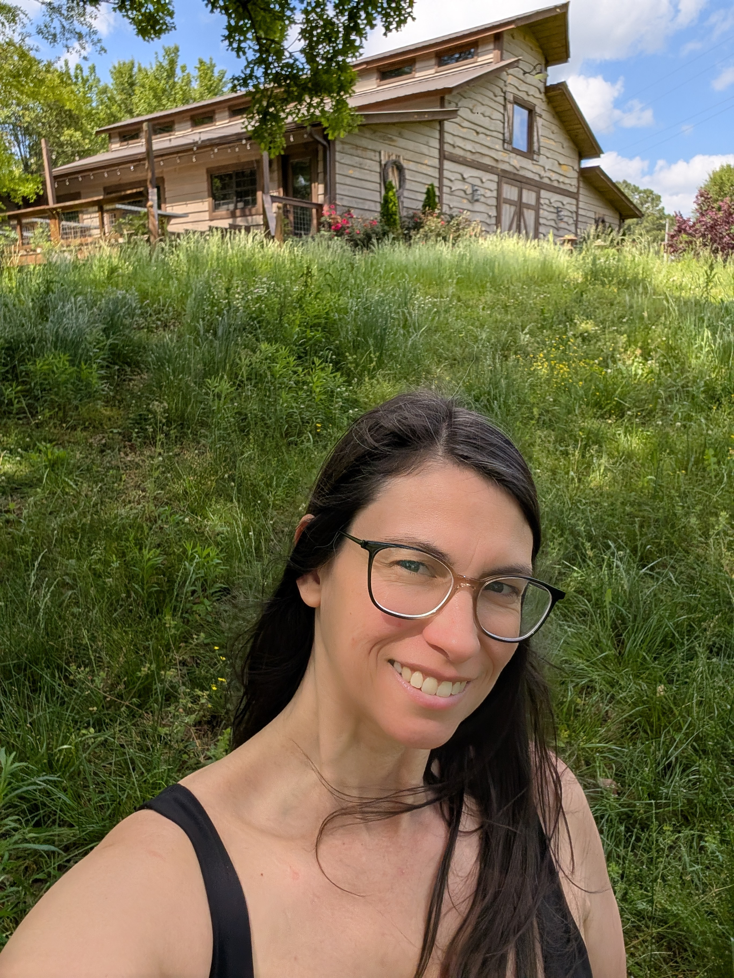 Brittany Kelchner standing in a wildflower meadow